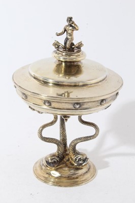 Lot 177 - Unusual Edwardian silver gilt cup and cover, the cup of circular form, on a circular base raised by three classical Dolphins and cover with finial depicting Triton, with presentation