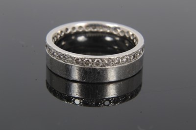Lot 188 - Platinum wedding ring with a full band of 32 round brilliant cut diamonds weighing 0.64 carats in total