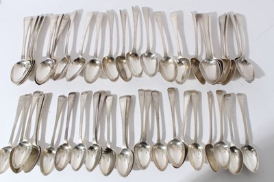 Lot 163 - Set of twenty-four Victorian silver Old English pattern feather edge table spoons