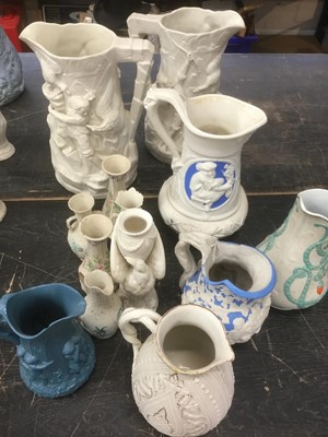 Lot 173 - Collection of Victorian Parian ware jugs, including signed example by W E Cobridge, and others, approximately 13