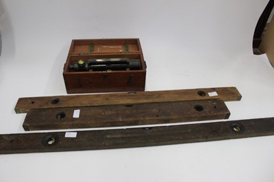 Lot 384 - Brass theodolite in case and three large spirit levels