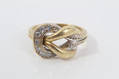 Lot 64 - 18ct gold and diamond knot ring