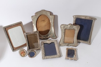 Lot 26 - Large Edwardian silver photograph frame with reeded borders and oval photograph aperture (Birmingham 1905) together with a group of eight other silver photograph frames various dates and makers (9)