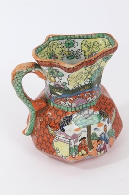 Lot 68 - A rare Masons Ironstone relief moulded jug, five other Masons jugs and two tooth brush vases