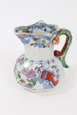 Lot 68 - A rare Masons Ironstone relief moulded jug, five other Masons jugs and two tooth brush vases
