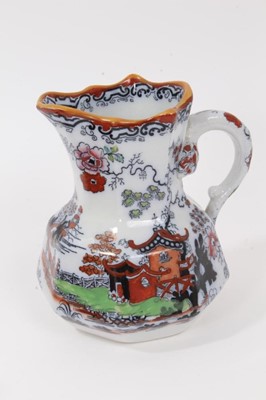 Lot 68 - A rare Masons Ironstone relief moulded jug, five other Masons jugs and two tooth brush vases
