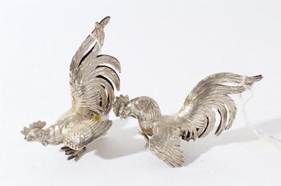 Lot 54 - Pair of silver models of fighting birds, London import hallmarks 1978, by Israel Freeman & Son Ltd