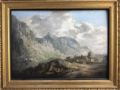 Lot 240 - After J. M. Turner, 19th century, oil on paper laid on panel - cottage beneath hills, bearing signature, in gilt frame, 27cm x 37cm