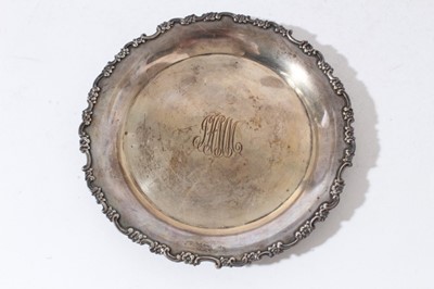 Lot 63 - Late 19th century American silver card tray of circular form with floral and scroll border and central engraved initials, by Tiffany & Co, marks circa 1892 - 1902, together with a letter of provena...