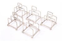 Lot 527 - Five 1920s silver individual toast racks of...