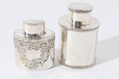 Lot 71 - George V silver tea caddy of cylindrical form with push fit cover and gadrooned borders (Chester 1915) together with another similar silver tea caddy (Sheffield 1894) all at 7oz, larger caddy 10cm...