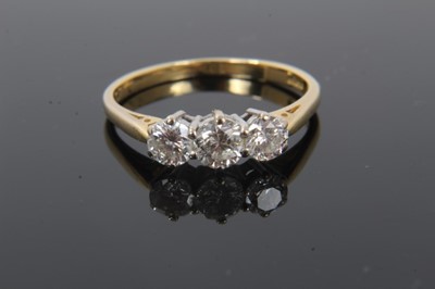 Lot 210 - Diamond three stone ring with three round brilliant cut diamonds estimated to weigh approximately 1.00ct in total on 18ct gold shank