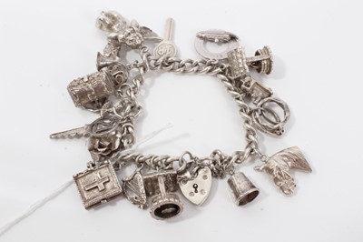 Lot 211 - Silver charm bracelet with sixteen silver charms