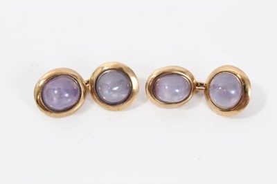 Lot 212 - Pair of gold and pink cabochon stone cufflinks