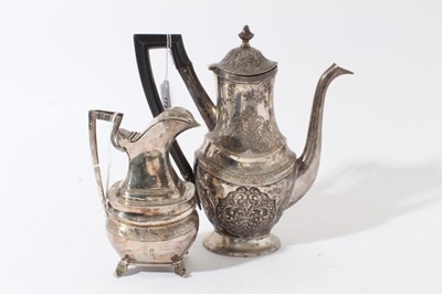Lot 173 - 19th century white metal coffee pot of oval baluster form with engraved and chased decoration and angular ebony handle, marked with a crowned letter L and 'L.S' to foot rim