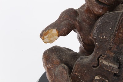 Lot 12 - Martin Brothers salt glazed pottery sculpture of a grotesque figure playing a cello