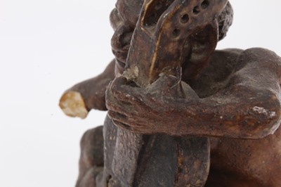 Lot 12 - Martin Brothers salt glazed pottery sculpture of a grotesque figure playing a cello