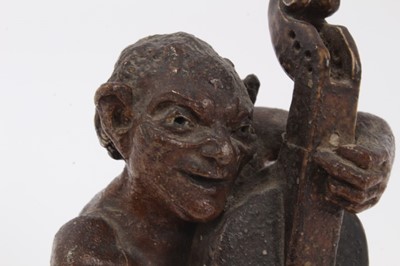 Lot 12 - Martin Brothers salt glazed pottery sculpture of a grotesque figure playing a cello