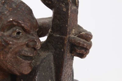 Lot 12 - Martin Brothers salt glazed pottery sculpture of a grotesque figure playing a cello