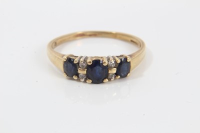 Lot 257 - 18ct gold diamond and sapphire ring