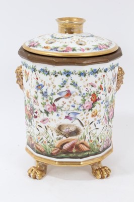Lot 119 - 19th century French porcelain bough pot, the faceted body with moulded masks and four lion's paw feet, decorated with various flora and fauna, the cover with openings for flower stems, 23cm height