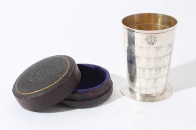 Lot 49 - Late Victorian Silver collapsible cup of tapered cylindrical form with engraved initials on reeded circular foot, in velvet lined fitted case