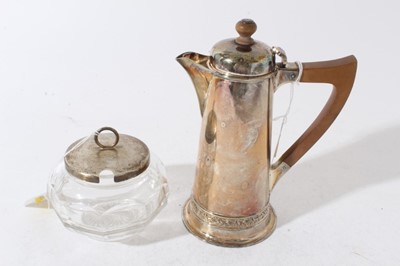 Lot 146 - George V silver hot water pot of tapered cylindrical form, domed hinged cover with turned wood finial and angular bakelite handle, (Birmingham 1918) together with a silver topped