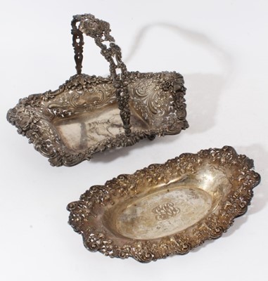 Lot 155 - Early 20th century American Sterling silver swing handled cake basket with ornate pierced and embossed decoration with foliate scroll borders, stamped to underside Shreve, Crump & Low Co., 40cm