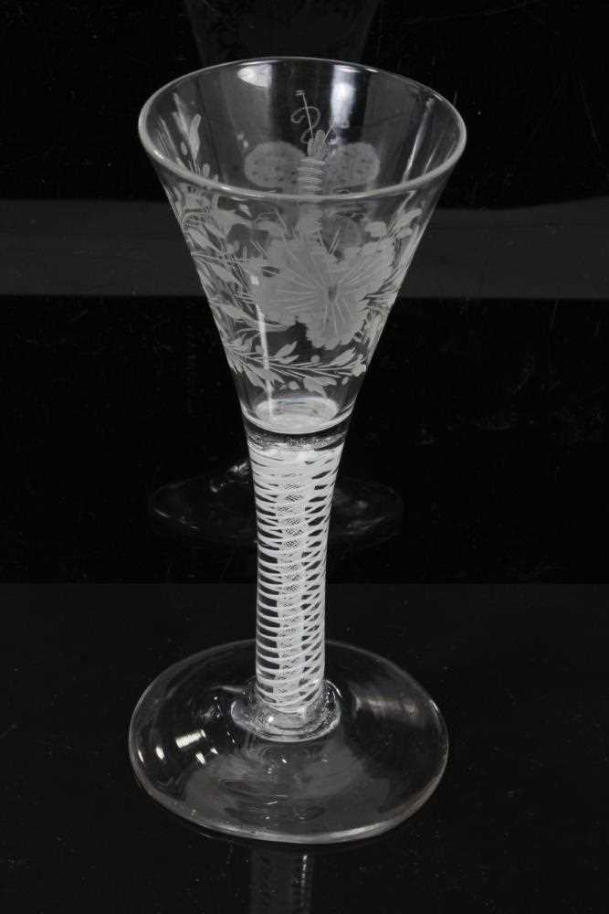 Lot 158 - Georgian double series opaque twist wine glass, c.1765, the trumpet bowl etched with flowers and a moth, over a stem consisting of four spiral threads outside gauze, above a conical foot, 16.5cm he...