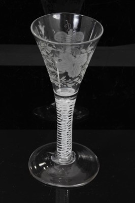 Lot 158 - Georgian double series opaque twist wine glass, c.1765, the trumpet bowl etched with flowers and a moth, over a stem consisting of four spiral threads outside gauze, above a conical foot, 16.5cm he...