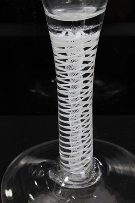 Lot 158 - Georgian double series opaque twist wine glass, c.1765, the trumpet bowl etched with flowers and a moth, over a stem consisting of four spiral threads outside gauze, above a conical foot, 16.5cm he...