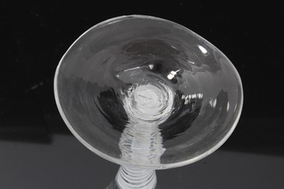 Lot 158 - Georgian double series opaque twist wine glass, c.1765, the trumpet bowl etched with flowers and a moth, over a stem consisting of four spiral threads outside gauze, above a conical foot, 16.5cm he...