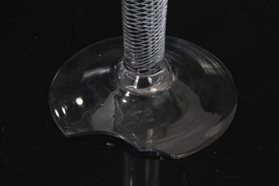 Lot 152 - Three Georgian wine glasses, c.1750, all with drawn trumpet bowls on multi-spiral air twist stems, 16cm to 16.75cm height