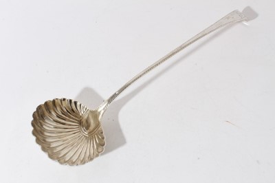 Lot 8 - George III silver old english pattern serving ladle with feather edge, engraved crest and scalloped bowl (London 1769), 6.5oz, 35cm in length
