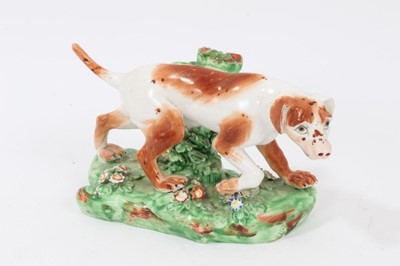 Lot 108 - Late 18th century Derby porcelain model of a Pointer, shown mid-stride on a grassy base, 16cm length from head to tail