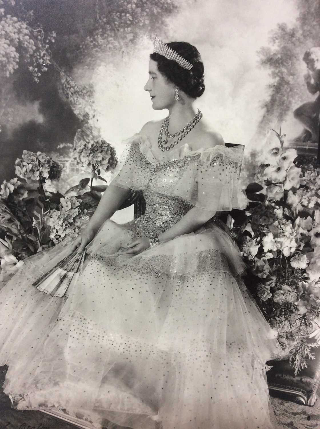 Lot 54 - H.M. Queen Elizabeth , fine 1939 Cecil Beaton black and white portrait photograph - The Queen wearing a beautiful sequinned ball gown and jewels with a painted classical garden scene backdrop, moun...
