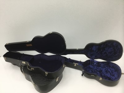 Lot 9 - Hard guitar case by Paxman, black finish, together with another Paxman guitar case with blue velvet lining, one other hard guitar case