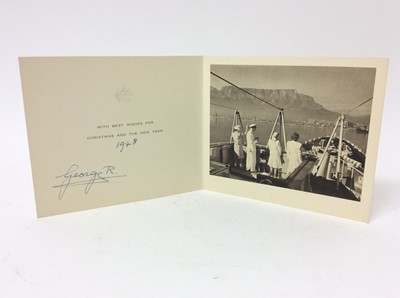 Lot 69 - H.M.King George VI - signed 1948 Christmas card with gilt embossed crown to cover, black and white photograph of the Royal family arriving by Ship on their tour of South Africa , signed in ink ' Ge...