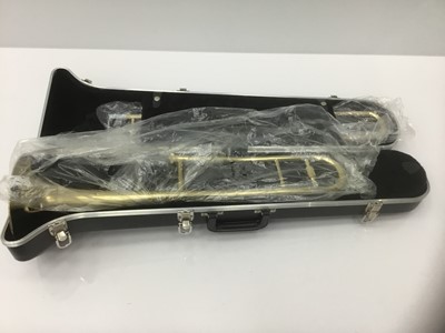Lot 24 - Blessing tenor trombone, brass finish, serial number 522182, with 12c mouthpiece, hard case, as new condition