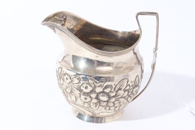 Lot 121 - George III silver milk / cream jug of bellied form with chased floral, foliate and scroll decoration (possibly later added), (London 1804), makers mark rubbed, all at 3.5oz, 10.3cm in height