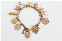 Lot 3233 - Gold (9ct) charm bracelet with various gold...