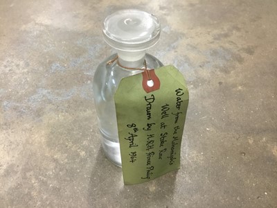 Lot 212 - Bottle of water from the Maharajahs well at Stoke Row, drawn by H.R.H. Prince Philip 8th April 1964 
provenance by descent from Peter Schmidt, a bodyguard for the Royal Family