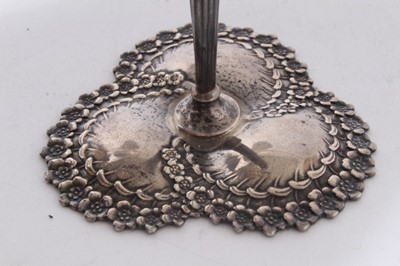 Lot 192 - Pair of early 20th century American silver bud vase holders, pierced tapered stems with floral decoration, on decorative bases, stamped Tiffany & Co, Sterling, all at 2oz