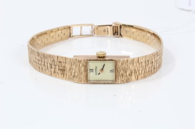 Lot 132 - Lady's 9ct gold Roamer wristwatch on integral gold bracelet