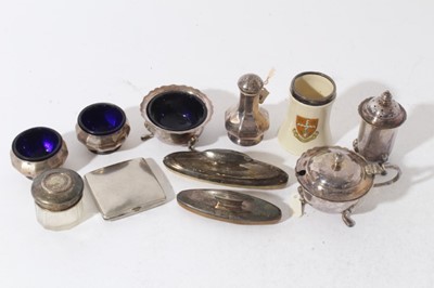 Lot 249 - George V silver three piece cruet set comprising pepperette of baluster form, together with pair of matching salt cellars with blue glass liners, (Birmingham 1918/ 1919), together with a silver pla...