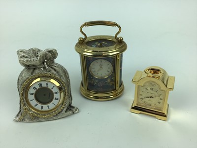 Lot 577 - Halcyon Days miniature enamel carriage clock with floral and butterfly decorations, 6.5cm high, plus two other miniature clocks