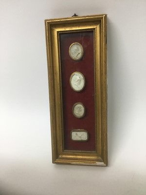 Lot 31 - Group of four 19th century Grand Tour framed plaster cameos, the largest approximately 3.5cm high, with gilt borders, in box frame