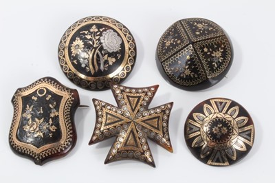 Lot 5 - Group of five 19th century tortoishell piqué work brooches various, with floral decoration to include a Maltese cross brooch, 32-40mm diameter