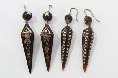 Lot 9 - Two pairs of 19th century piqué work earrings with star and floral decoration, approximately 60mm length
