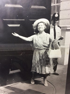 Lot 112 - H.M. Queen Elizabeth The Queen Mother , large photograph of Her Majesty enthusiastically receiving birthday wishes from the public outside Clarence House , another of a young Prince Charles raising...